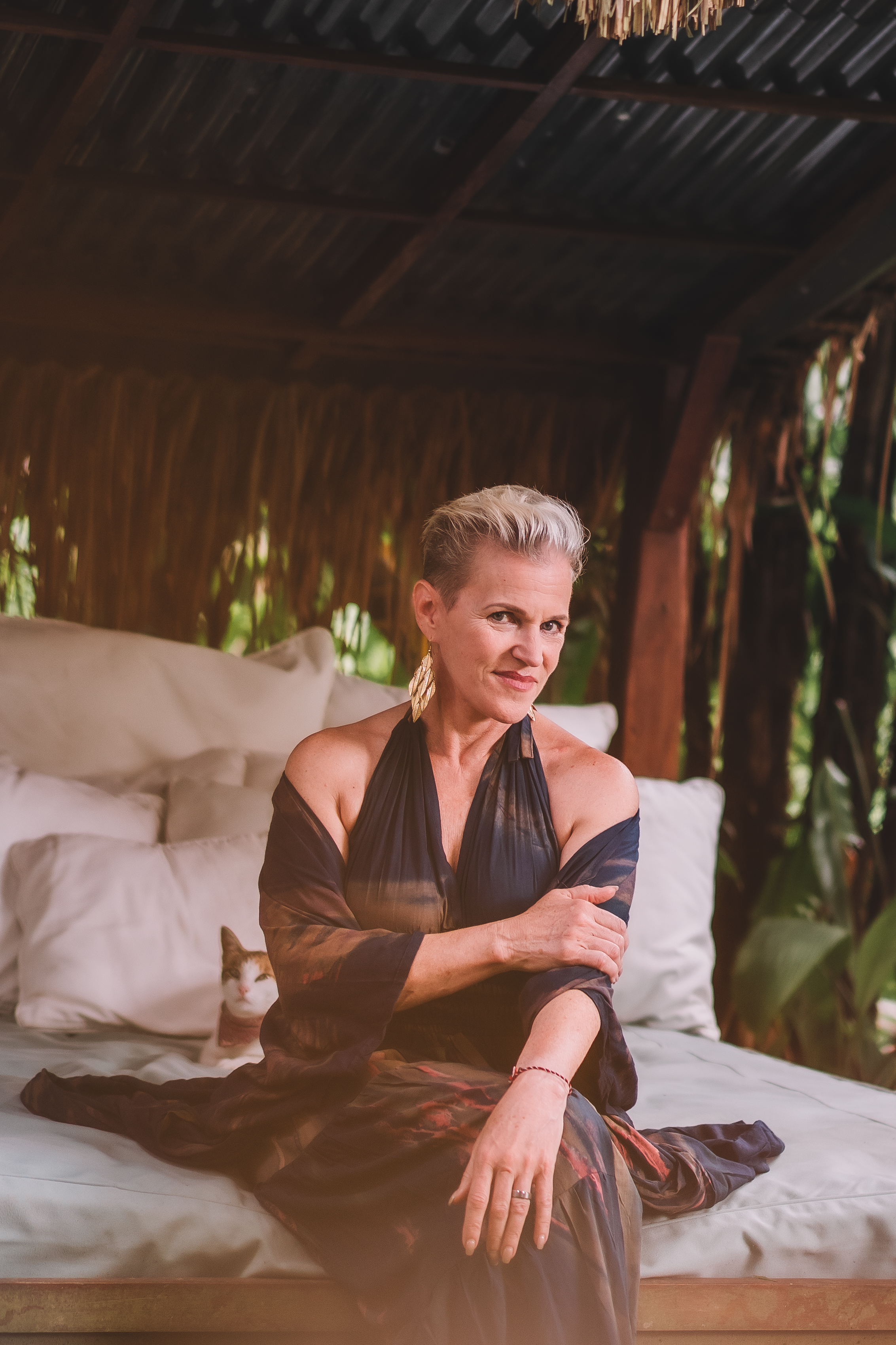 Shannon Guthrie seated in a lush outdoor setting in Bali